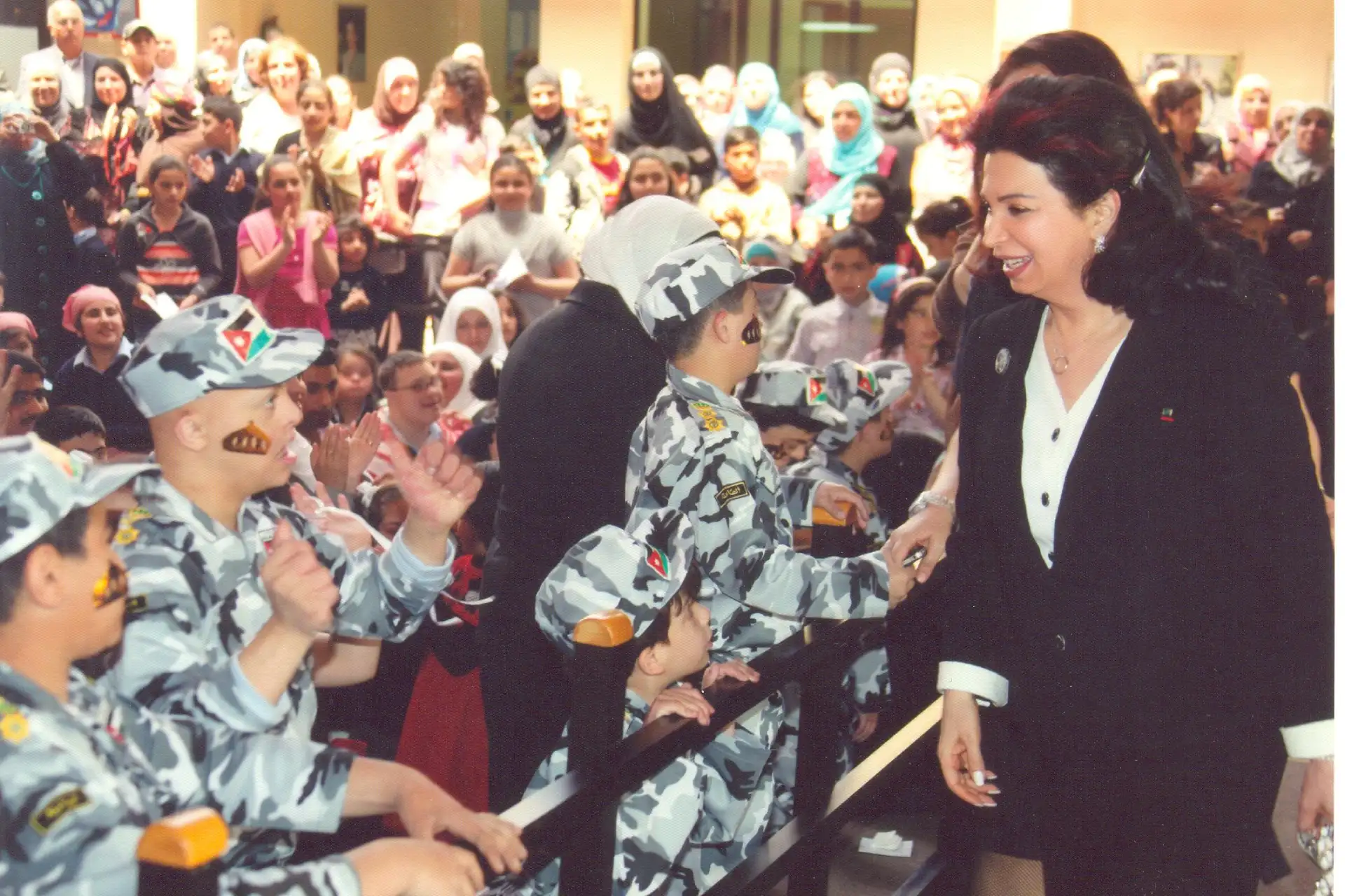 Mrs. Nazik Rafik Hariri with staff and students at the Nazik Al-Hariri Center for Special Education in Amman, 2013
